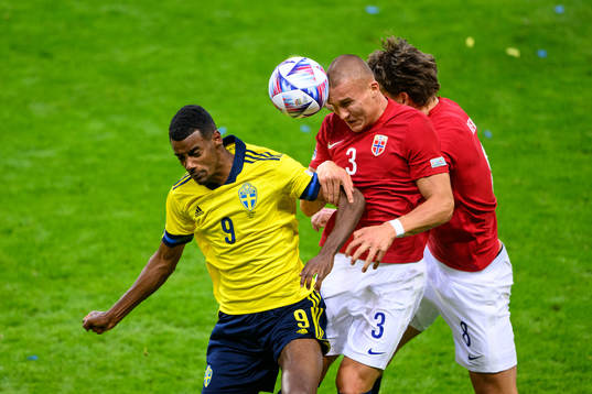 Alexander Isak of Sweden and Leo Skiri Østigård and