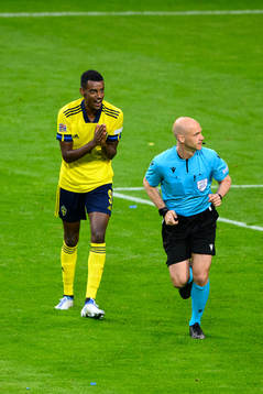 Alexander Isak of Sweden reacts towards referee Anthony