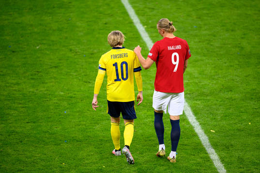 Emil Forsberg of Sweden and Erling Braut Haaland of Norway