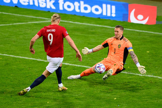 Goalkeeper Robin Olsen saves a shot from Erling Braut