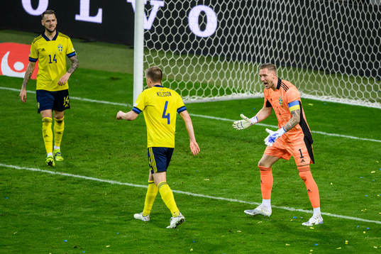 goalkeeper Robin Olsen reacts towards Joakim Nilsson of