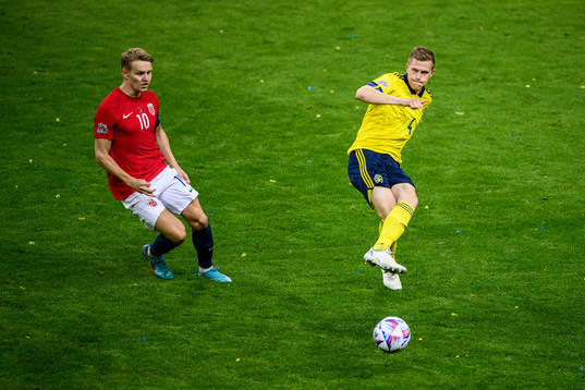 Martin Ødegaard of Norway and Joakim Nilsson of Sweden