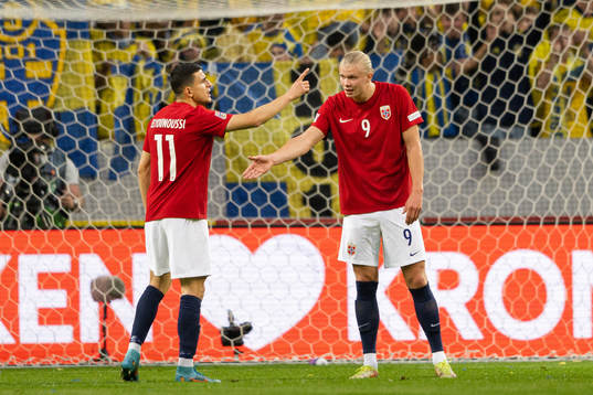 Mohamed Elyounoussi and Erling Braut Haaland of Norway