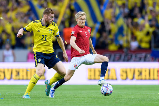 Dejan Kulusevski of Sweden and Birger Melingof Norway
