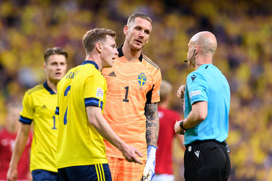 Emil Krafth of Sweden receives a yellow card