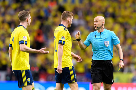 Emil Krafth and Dejan Kulusevski of Sweden talks to referee