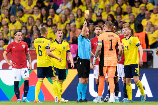 Goalkeeper Robin Olsen of Sweden receives a yellow card