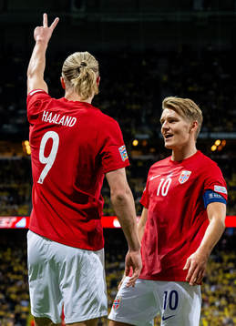 Erling Braut Haaland of Norway celebrates with teammate