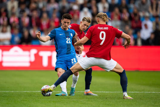 Benjamin Verbic of Slovenia and Erling Braut Haaland of