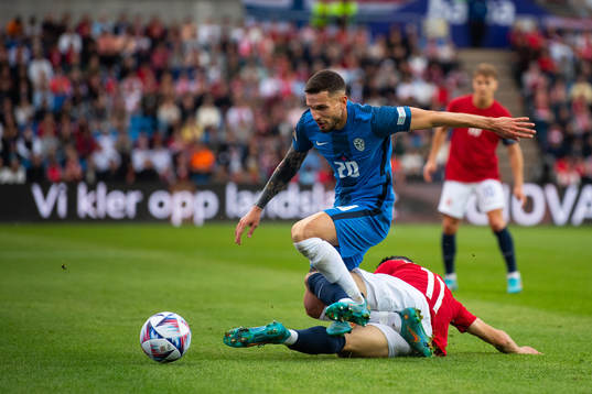 Mohamed Amine Elyounoussi of Norway and Petar Stojanovic of