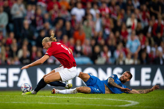 Erling Braut Haaland of Norway and Miha Blazic of Slovenia