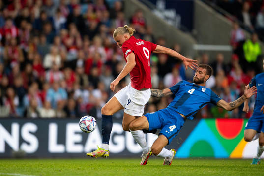 Erling Braut Haaland of Norway and Miha Blazic of Slovenia
