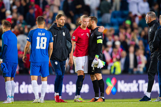 Erling Braut Haaland of Norway and Jan Oblak of Slovenia