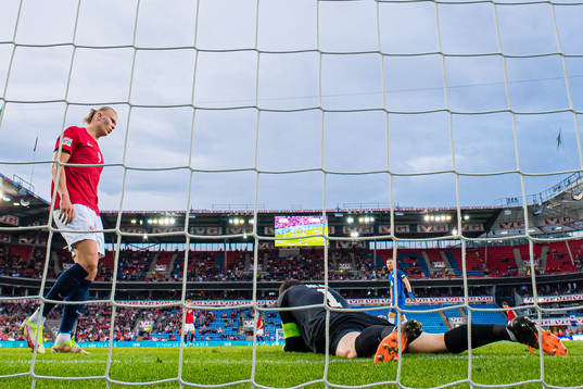 Erling Braut Haaland of Norway and Jan Oblak of Slovenia