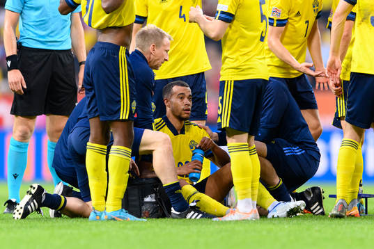 Robin Quaison of Sweden receive medical attention