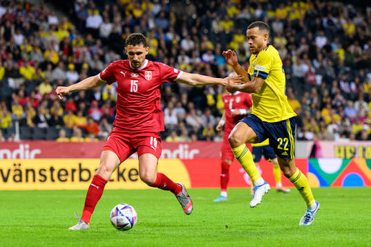 Milos Veljkovic of Serbia and Robin Quaison of Sweden