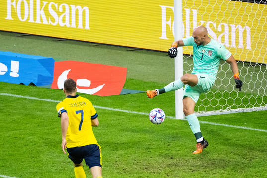 Goalkeeper Marko Dmitrovic of Serbia and Viktor Claesson of