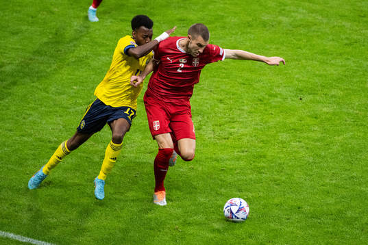 Anthony Elanga of Sweden and Strahinja Pavlovic of Serbia