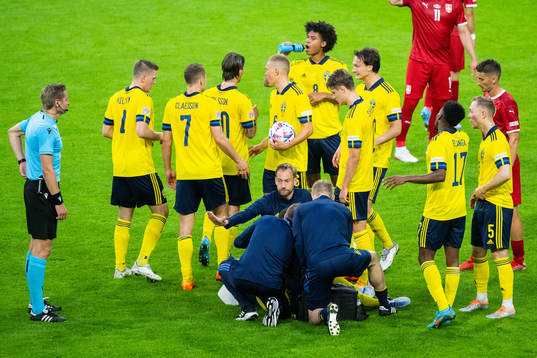 Robin Quaison of Sweden receives medical attention