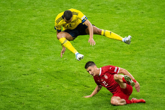 Robin Quaison of Sweden and Filip Duricic of Serbia