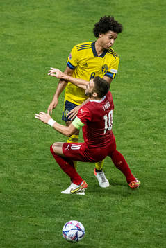 Dusan Tadic of Serbia and Jens Cajuste of Sweden