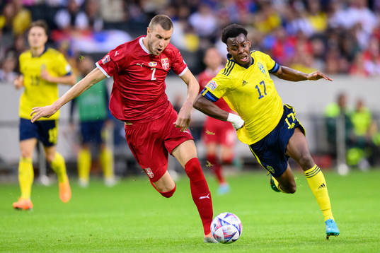 Strahinja Pavlovic of Serbia and Anthony Elanga of Sweden