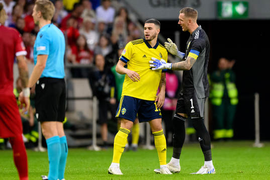 Edvin Kurtulus and goalkeeper Robin Olsen of Sweden