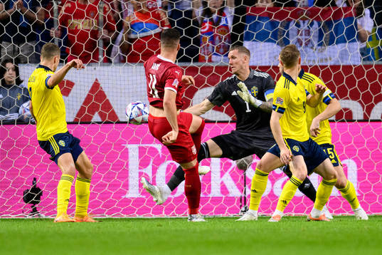 of Serbia Luka Jovic scores 0-1 bahind goalkeeper Robin