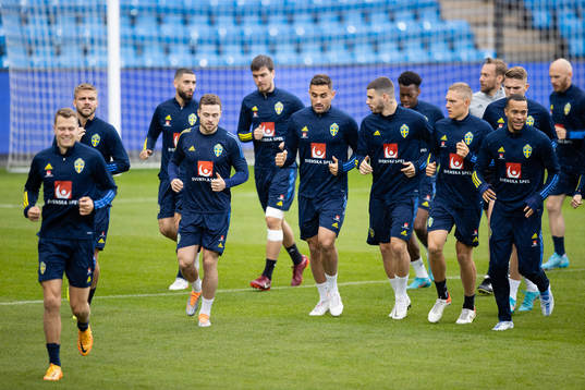 Players of the Swedish national football team warming up