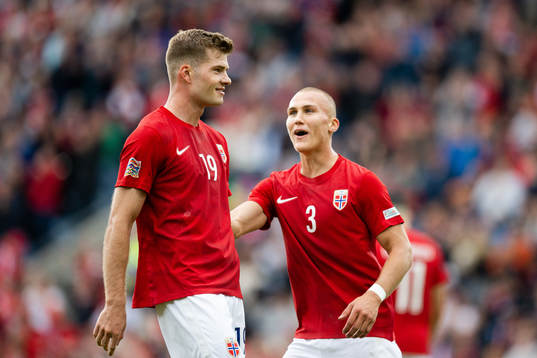 Alexander Sørloth and Leo Østigård of Norway celebrate