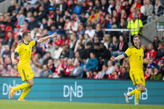 Viktor Claesson and Emil Krafth of Sweden celebrate the 2-1