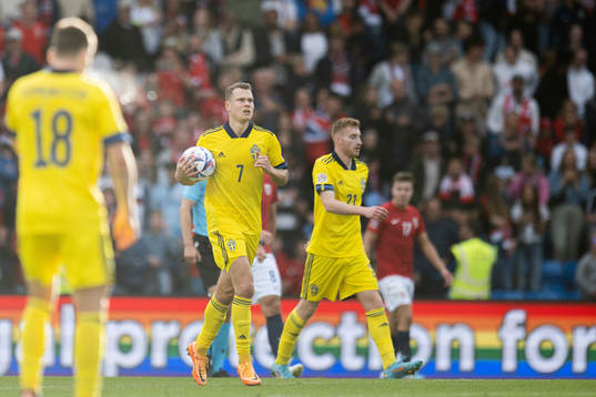 Viktor Claesson and Dejan Kulusevski of Sweden celebrate