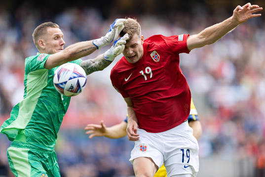 Goalkeeper Robin Olsen of Sweden and Alexander Sørloth of