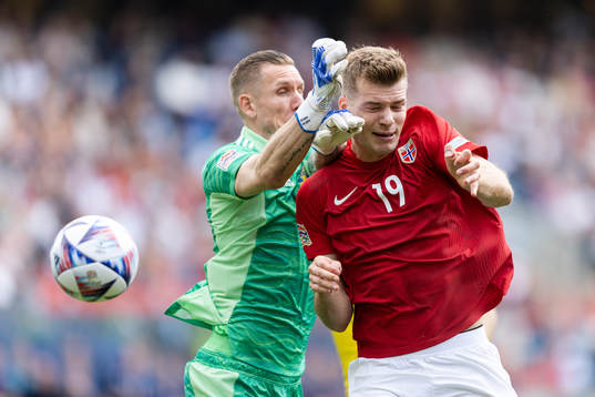 Goalkeeper Robin Olsen of Sweden and Alexander Sørloth of