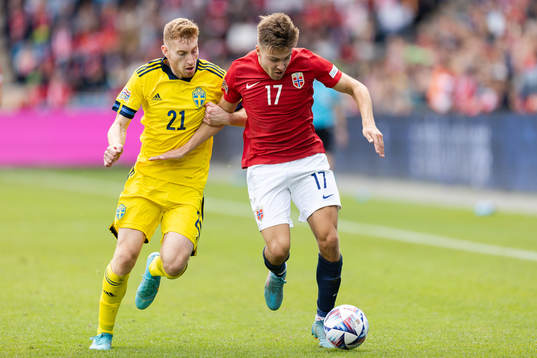 Dejan Kulusevski of Sweden and Fredrik Bjørkan of Norway