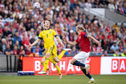 Hjalmar Ekdal of Sweden and Erling Haaland of Norway