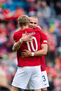 Martin Ødegaard and Leo Østigård of Norway celebrate