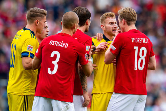 Viktor Gyökeres and Dejan Kulusevski of Sweden argue with