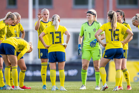 Wilma Carlsson and goalkeeper Emma Holmgren of Sweden