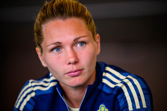 Goalkeeper Jennifer Falk is interviewed by the media