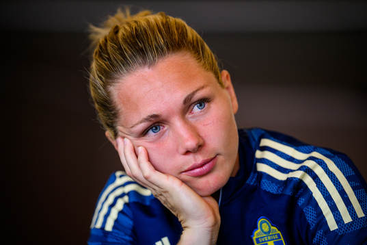 Goalkeeper Jennifer Falk is interviewed by the media