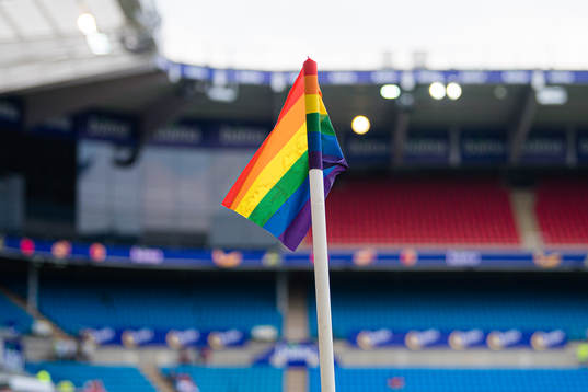 A rainbow-colored corner flag