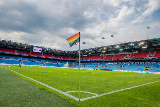 A rainbow-colored corner flag at Ullevaal Stadion