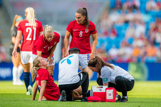 Lisa Fjeldstad Naalsund of Norway leaves the pitch with an