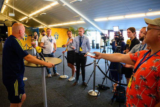 Magnus Wikman, assistant coach is interviewed by the media