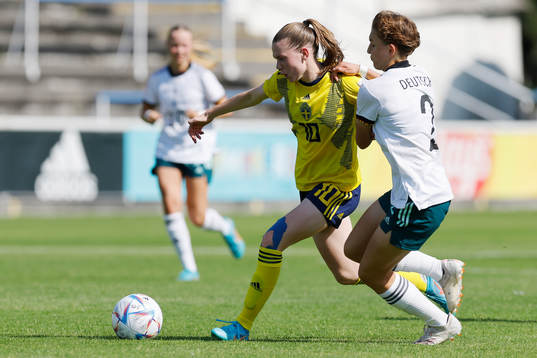 Bea Sprung of Sweden in action against Pauline Deutsch of