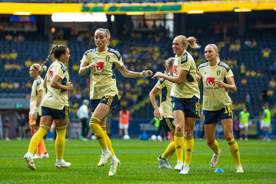 Kosovare Asllani and Magdalena Eriksson of Sweden