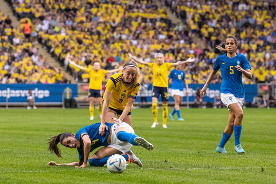 Rafaelle of Brazil and Kosovare Asllani of Sweden