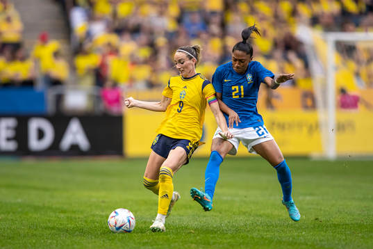 Kosovare Asllani of Sweden and Kerolin of Brazil