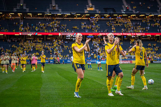 Stina Blackstenius and Caroline Seger of Sweden celebrate